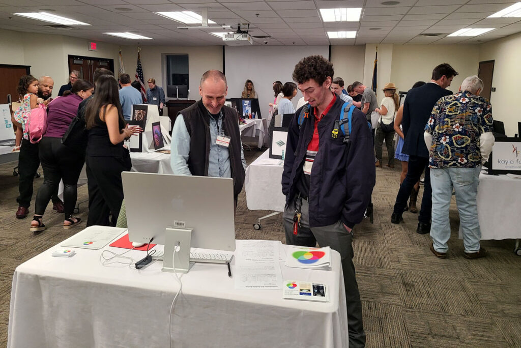 Two people talking about design work